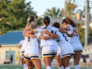 The Lions huddling up (Photo courtesy of Elizabeth Gladstone / Multiamedia Coordinator).