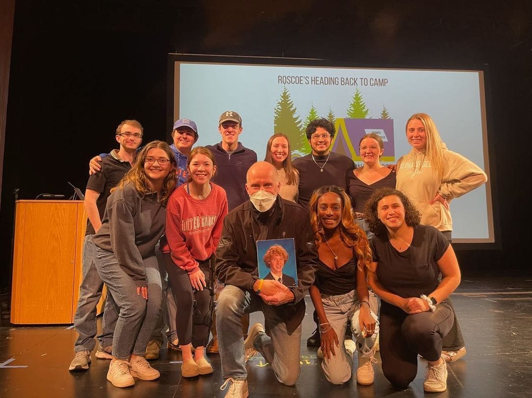 Joe McDonough, President of The Andrew McDonough B+ (Be Positive) Foundation, with students of the College (Photo courtesy of @tcnjam).