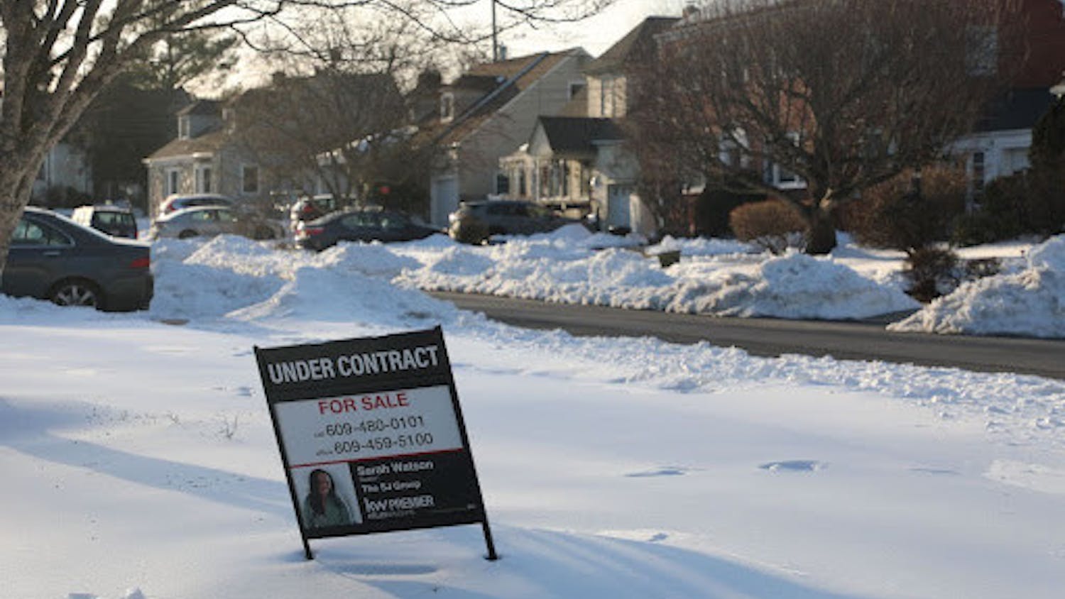 A sale sign is posted in front of a house in a Ewing neighborhood. (Photo by Andre Paras / Video Editor)