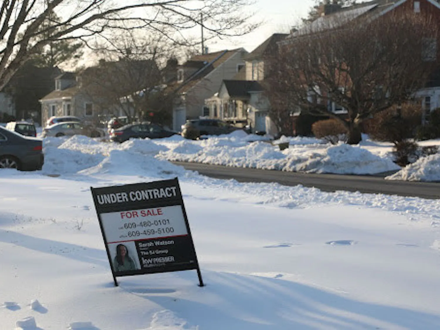 A sale sign is posted in front of a house in a Ewing neighborhood. (Photo by Andre Paras / Video Editor)