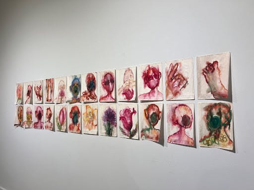 While the works of each artist vary in their portrayal of the theme, the group collectively conveys themes of mourning and solidarity. (Photo by Riley Eisenbeil / Staff Writer / “My Beautiful. Wife?” by Maria Kulikovska)