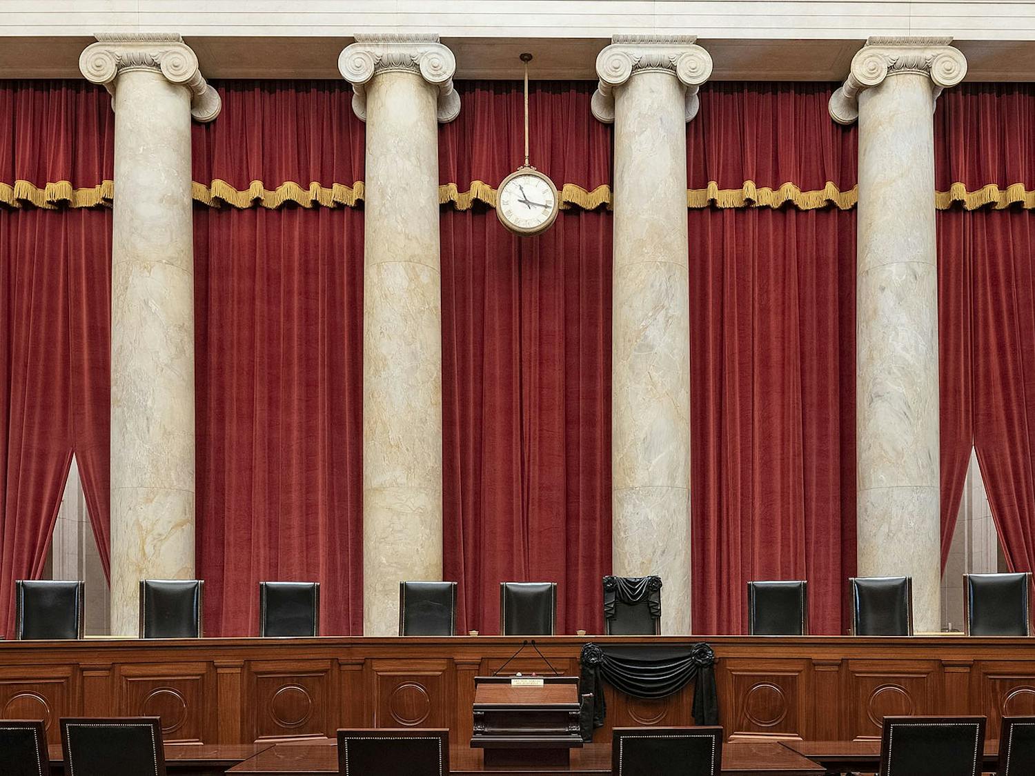 On Nov. 13, the Supreme Court made a decision that will forever alter the structure of American government (Photo courtesy of Wikimedia Commons/“Courtroom of the Supreme Court with Associate Justice Ruth Bader Ginsburg’s chair and the bench in front of her seat draped in black” by Fred Schilling, Collection of the Supreme Court of the United States. PD US SCOTUS. September 19, 2020). 