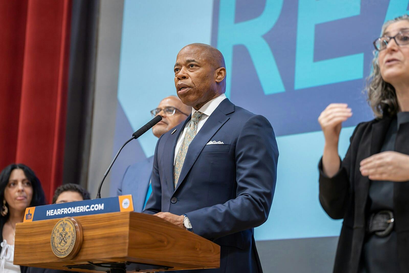 New York City Mayor Eric Adams intensely advocated for Congress and the Biden administration to take action in helping the city deal with the exceeding numbers of migrants entering the city shelter systems (Photo courtesy of Wikimedia Commons/“NYC SCHOOLS CHANCELLOR ANNOUNCES NYC READS” by New York City Public Schools Press Office. May 9, 2023). 