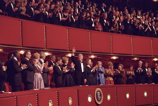 Former President Bill Clinton, Former First Lady Hillary Rodham Clinton and a crowd gathered within the Kennedy Center for Performing Arts in December 2000. (Photo courtesy of Wikimedia Commons)