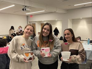Students pose with their decorated pots (Photo Courtesy of Isabella Darcy / Staff Writer).