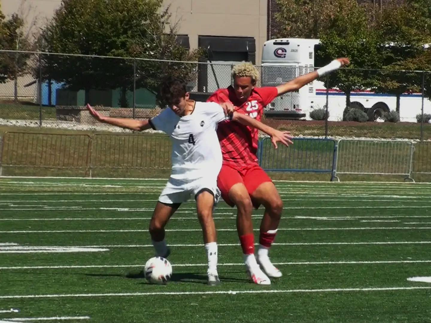 Lions freshman Matt Maceri defends the ball from a Montclair State player. (Photo by Nick Kurti / Staff Writer)
