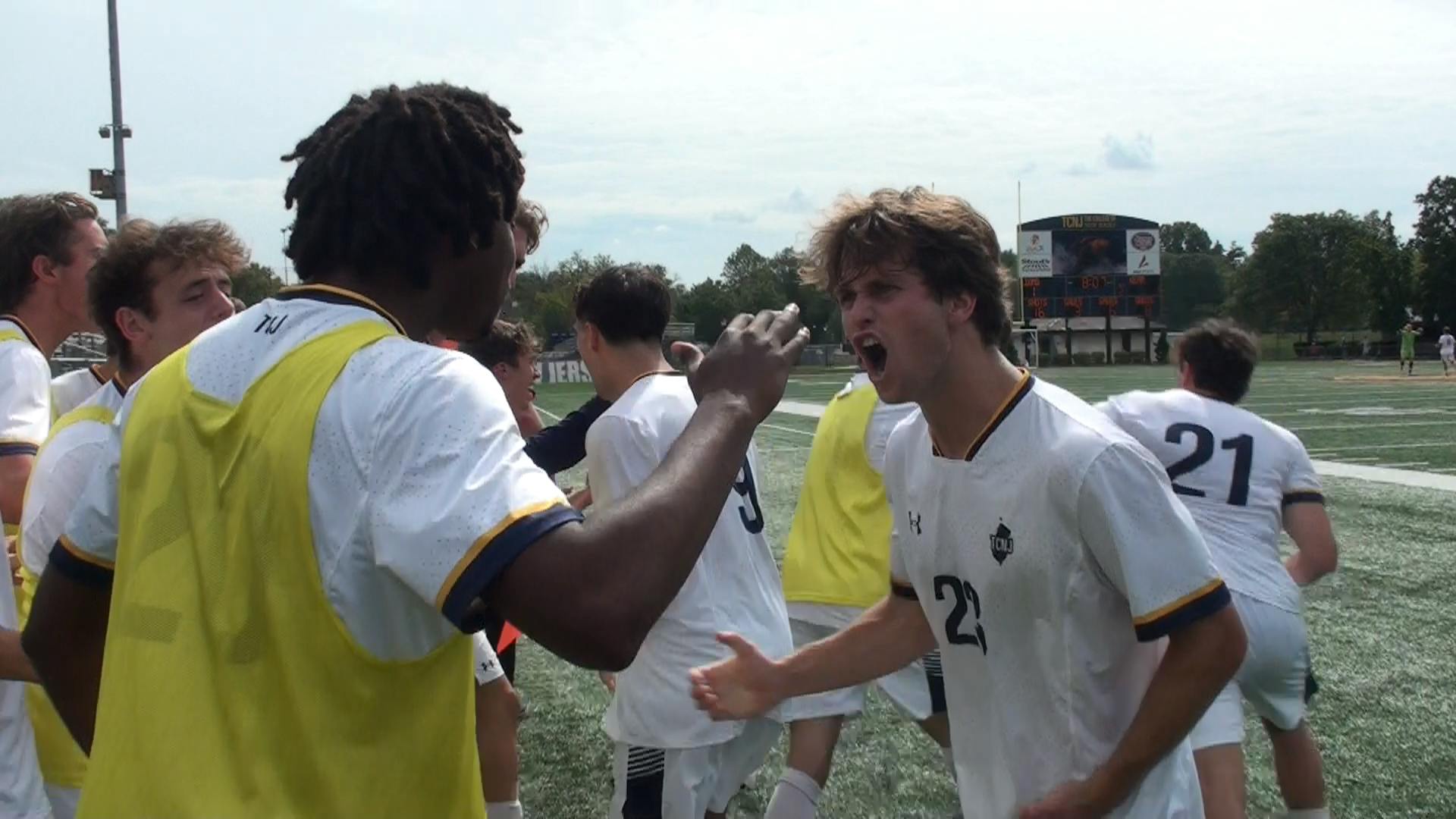 Junior Sean Wood celebrates the Lion’s game-tying goal versus Kean with sophomore Omar Pollard. (Photo by Nick Kurti)