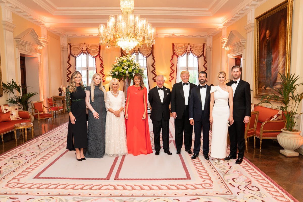 Donald, Donald Jr., Eric, and Ivanka Trump pose with Britain’s Prince of Wales and the Duchess of Cornwall in June 2019 (Photo Courtesy of Flickr / “President Trump and First Lady Melania Trump at Winfield House” by Trump White House Archives. June 5, 2019). 
