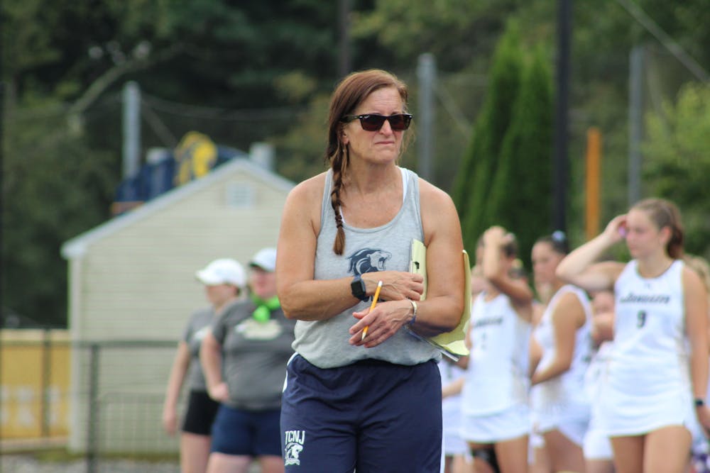 <p><em>Lions head coach Sharon Pfluger on the sideline (Photo courtesy of Elizabeth Gladstone). ﻿</em></p>