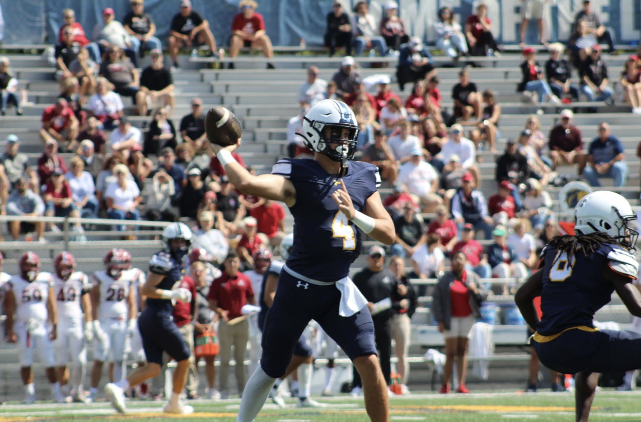 Senior quarterback Trevor Bopp dropping back for a pass (Photo courtesy of Elizabeth Gladstone / Multimedia Coordinator).