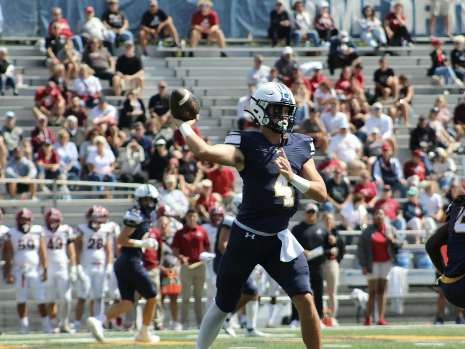 Senior quarterback Trevor Bopp dropping back for a pass (Photo courtesy of Elizabeth Gladstone / Multimedia Coordinator).