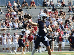 Senior quarterback Trevor Bopp dropping back for a pass (Photo courtesy of Elizabeth Gladstone / Multimedia Coordinator).