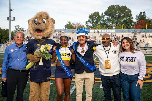 2026 Lion Royalty winners Janelle Estime and Estevan Escamilla Zarate pictured alongside Roscoe the Lion and faculty of the College. (Photo by Andre Paras / Managing Editor)