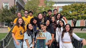 The freshman, sophomore, junior and senior class councils with Chalileh (center). Chalileh is holding the homecoming trophy that will be presented to the winning class (Photo courtesy of Aria Chalileh). 