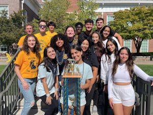 The freshman, sophomore, junior and senior class councils with Chalileh (center). Chalileh is holding the homecoming trophy that will be presented to the winning class (Photo courtesy of Aria Chalileh). 