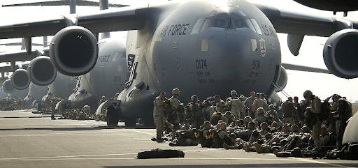 US army paratroopers preparing to board a C-17 Globemaster III aircraft during Operation Iraqi Freedom on March 23, 2003. (Photo courtesy of Wikimedia Commons)