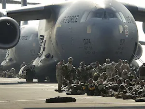 US army paratroopers preparing to board a C-17 Globemaster III aircraft during Operation Iraqi Freedom on March 23, 2003. (Photo courtesy of Wikimedia Commons)