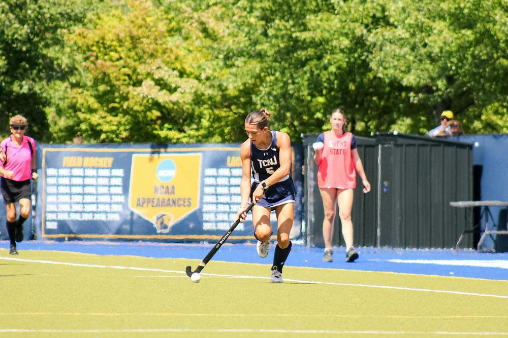 <p>Senior Emma McElroy drives up the field.</p>