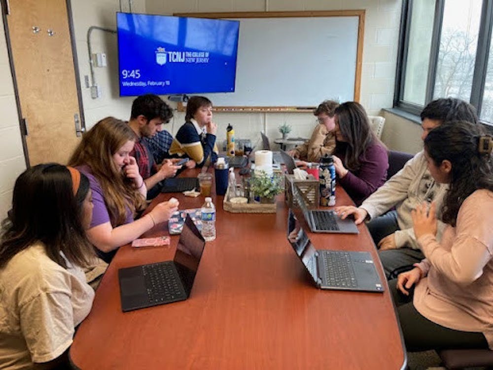 <p><em>Day to End Rape Culture committee discusses their flyers at their Feb. 18 meeting in Forcina Hall. (Photo by Franc Romanowski)</em></p><p></p>