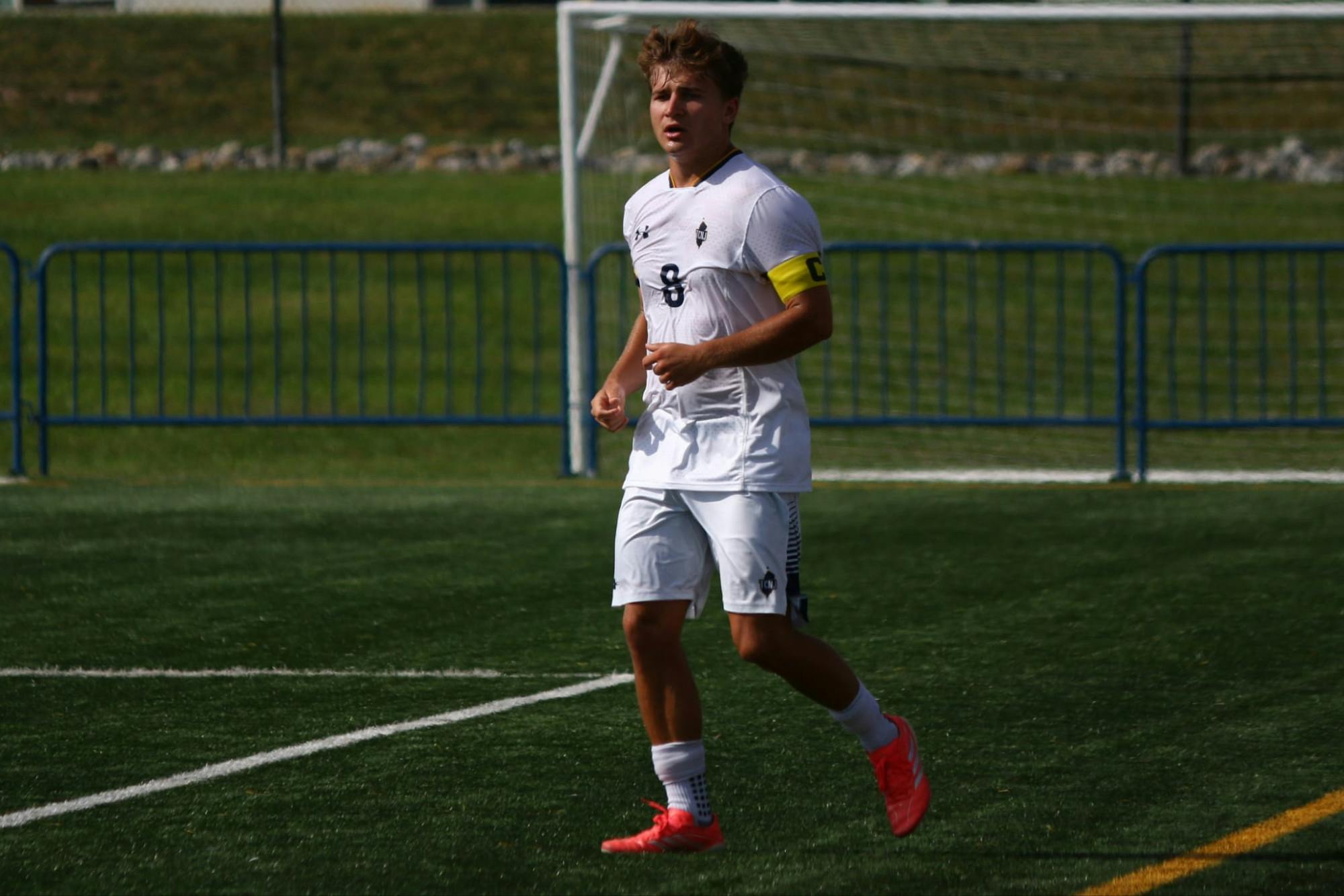 Sophomore Aidan Grund completes a pass against Farmingdale State