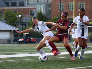 Junior Jenny Ward battles for the ball against Arcadia