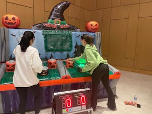 Students participating in the “Pumpkin Smash” game (Photo courtesy of Parisa Burton / Correspondent). 