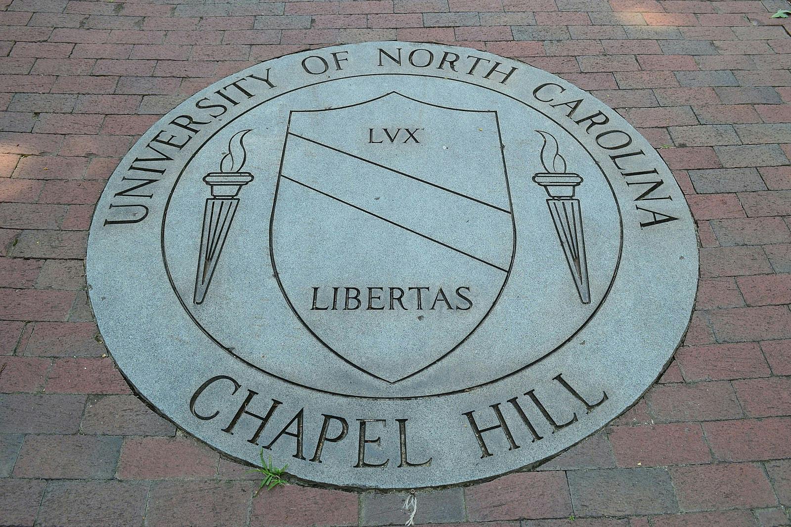 A graduate student has been charged with first-degree murder after fatally shooting his faculty advisor at the University of North Carolina-Chapel Hill (Photo courtesy of Wikimedia Commons/“University Of North Carolina At Chapel Hill School Seal” by William Yeung. August 4, 2013). 