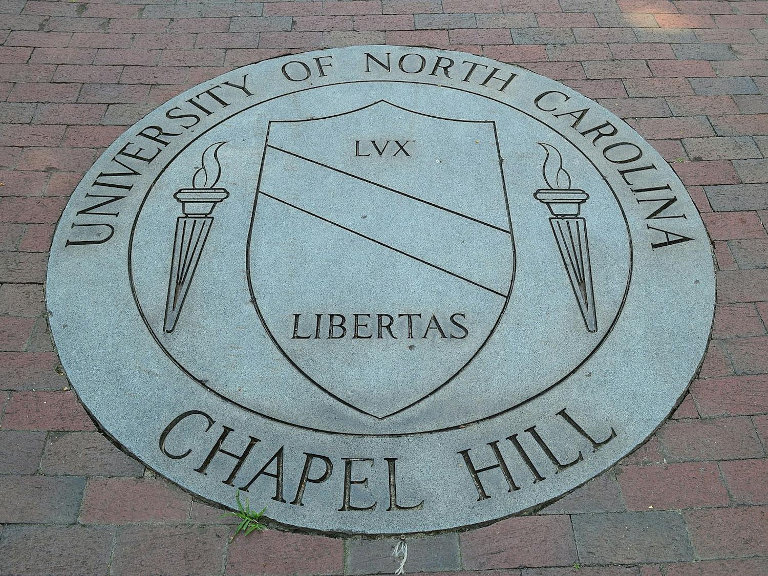 A graduate student has been charged with first-degree murder after fatally shooting his faculty advisor at the University of North Carolina-Chapel Hill (Photo courtesy of Wikimedia Commons/“University Of North Carolina At Chapel Hill School Seal” by William Yeung. August 4, 2013). 