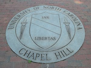 A graduate student has been charged with first-degree murder after fatally shooting his faculty advisor at the University of North Carolina-Chapel Hill (Photo courtesy of Wikimedia Commons/“University Of North Carolina At Chapel Hill School Seal” by William Yeung. August 4, 2013). 