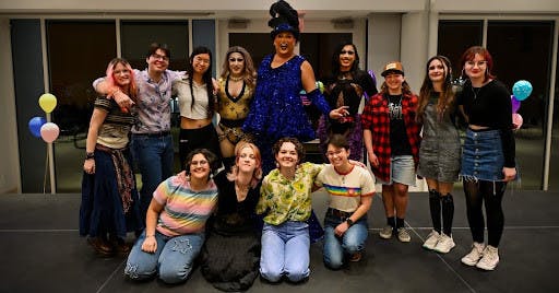 The Prism executive board poses with the queens. (Photo by Nick DeCesare)