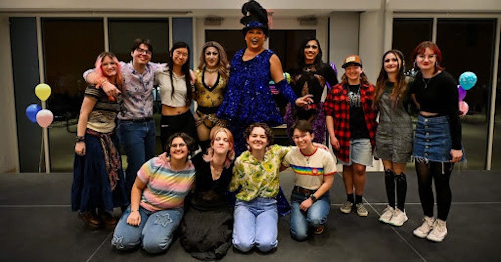 <p><em>The Prism executive board poses with the queens. (Photo by Nick DeCesare)</em></p>