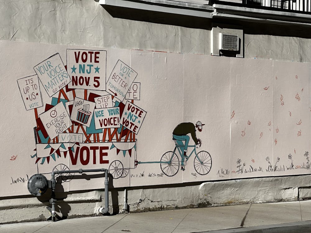 <p><em>“The Wagon,” a vote mural made by </em><a href="https://artscouncilofprinceton.org/new-on-spring-street-the-wagon/" target=""><em>Artist Member of The Month Eugenia Porello</em></a><em>, can be found on Spring Street in Princeton, New Jersey (Photo by Giya Khurana).</em></p>