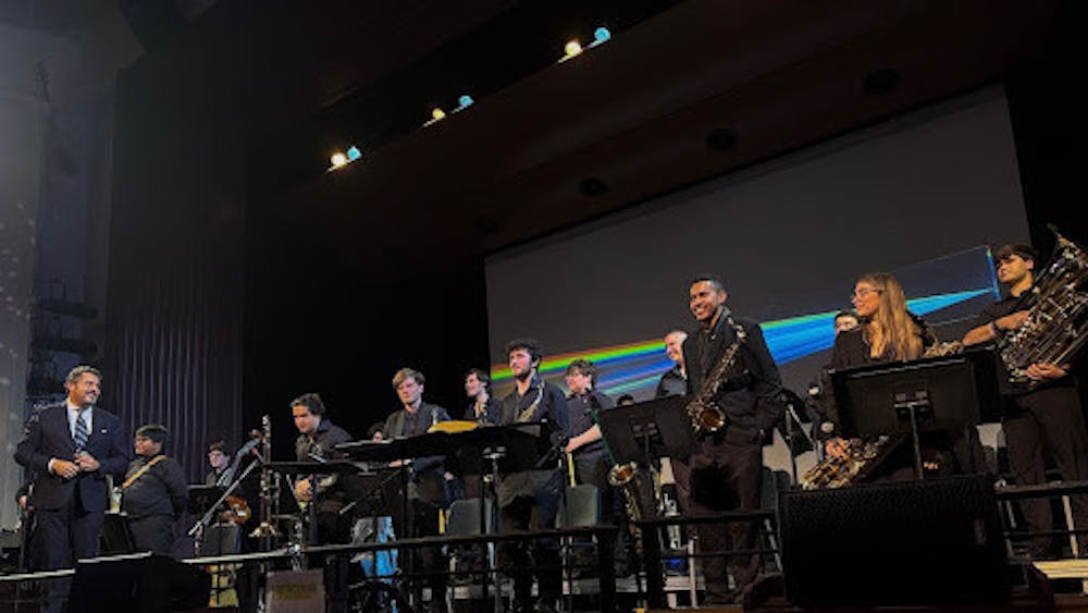 <p><em>The College’s Jazz Ensemble takes a bow. (Photo courtesy of Devyn Briones)</em></p>