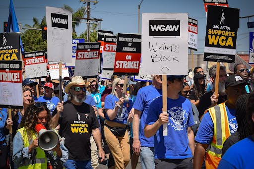 Jimmy Kimmel, Jimmy Fallon, Stephen Colbert and Seth Meyers all announced that their shows would return on Oct. 2, while John Oliver announced his show would return Oct. 1 (Photo courtesy of Wikimedia Commons / “WGA Strike 6.21.2023 024” by ufcw770. June 21, 2023). 