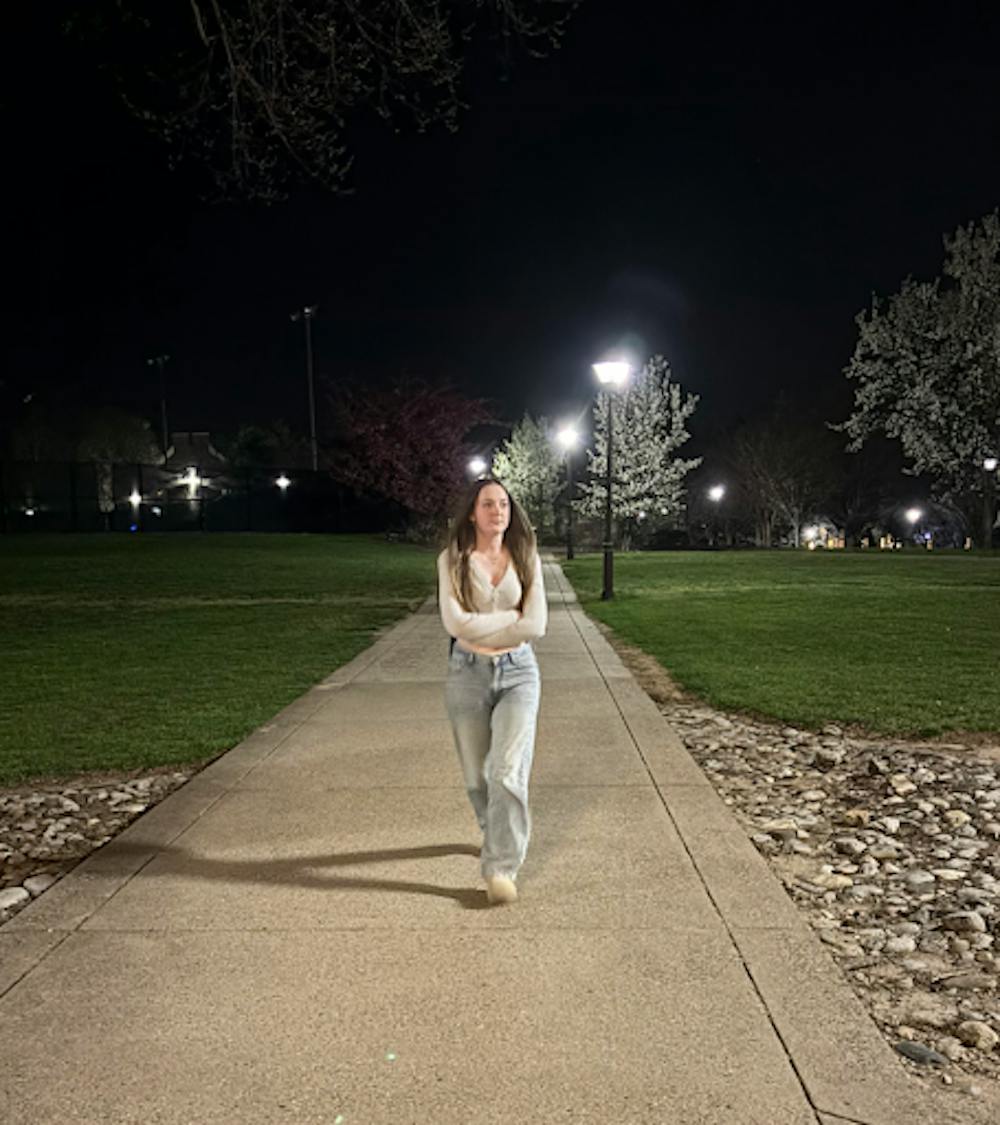 <p><em>Freshman nursing major Olivia White walks back to Wolfe Hall after class in April. (Photo by Isabella McHugh)</em></p><p></p>