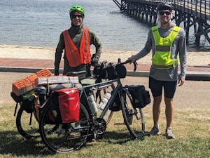 Matthew Smith and Mark Koerner in Yorktown, Virginia at the beginning of their trip through the TransAmerica bike trail (Photo courtesy of @mattandmarkcrossamerica via Instagram. August 26, 2023).