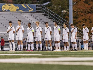 The College's starters during the national anthem before the game (Photo courtesy of Derick Zelaya).