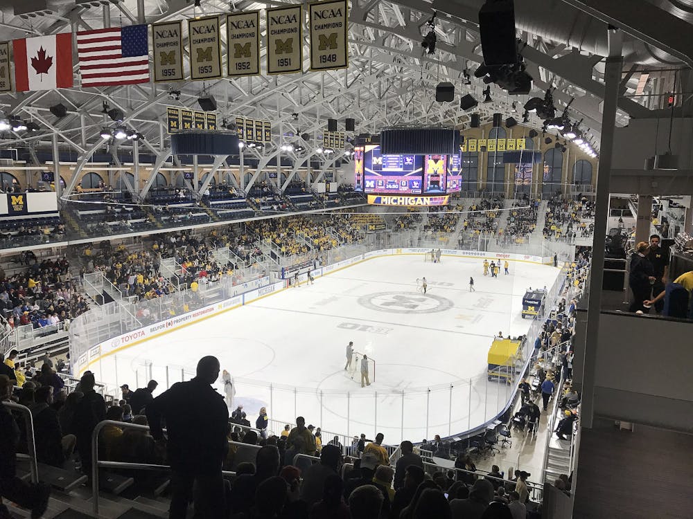 <p><em>A hockey rink with filled stands for a game. (Photo courtesy of </em><a href="https://commons.wikimedia.org/wiki/File:Yost_Ice_Arena,_Michigan_Ice_Hockey_Game_During_Intermission.jpg" target=""><em>Wikimedia Commons</em></a><em>)</em></p>