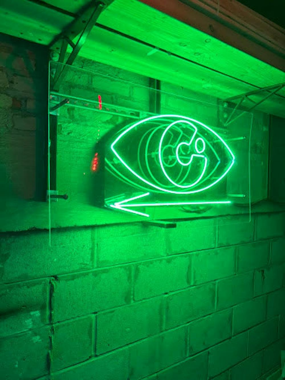 <p><em>The Kit Kat Club logo lighting the hallway of the August Wilson Theater. (Photo by Mia Shea)</em></p><p><strong><br/></strong></p>