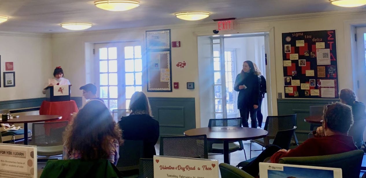 Senior Zoe Talbot reading to students and faculty (Photo Courtesy of Alexandra Copeland).