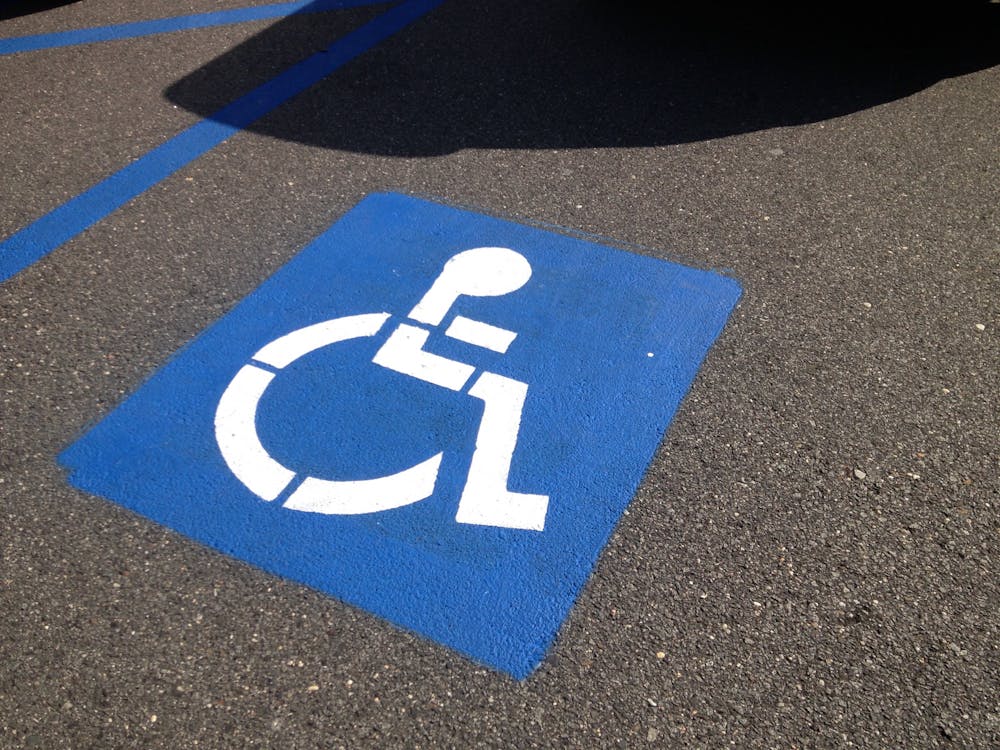 <p>The College’s Accessibility Resource Center (ARC) gives students with disabilities access to a broad range of accommodations for mental and physical disabilities, such as time extensions on assignments and housing accommodations. (Photo courtesy of <a href="https://flic.kr/p/qvrCE5" target="">Flickr</a>/“Accessible Parking” by SmartSign/Aug. 16, 2013)</p>