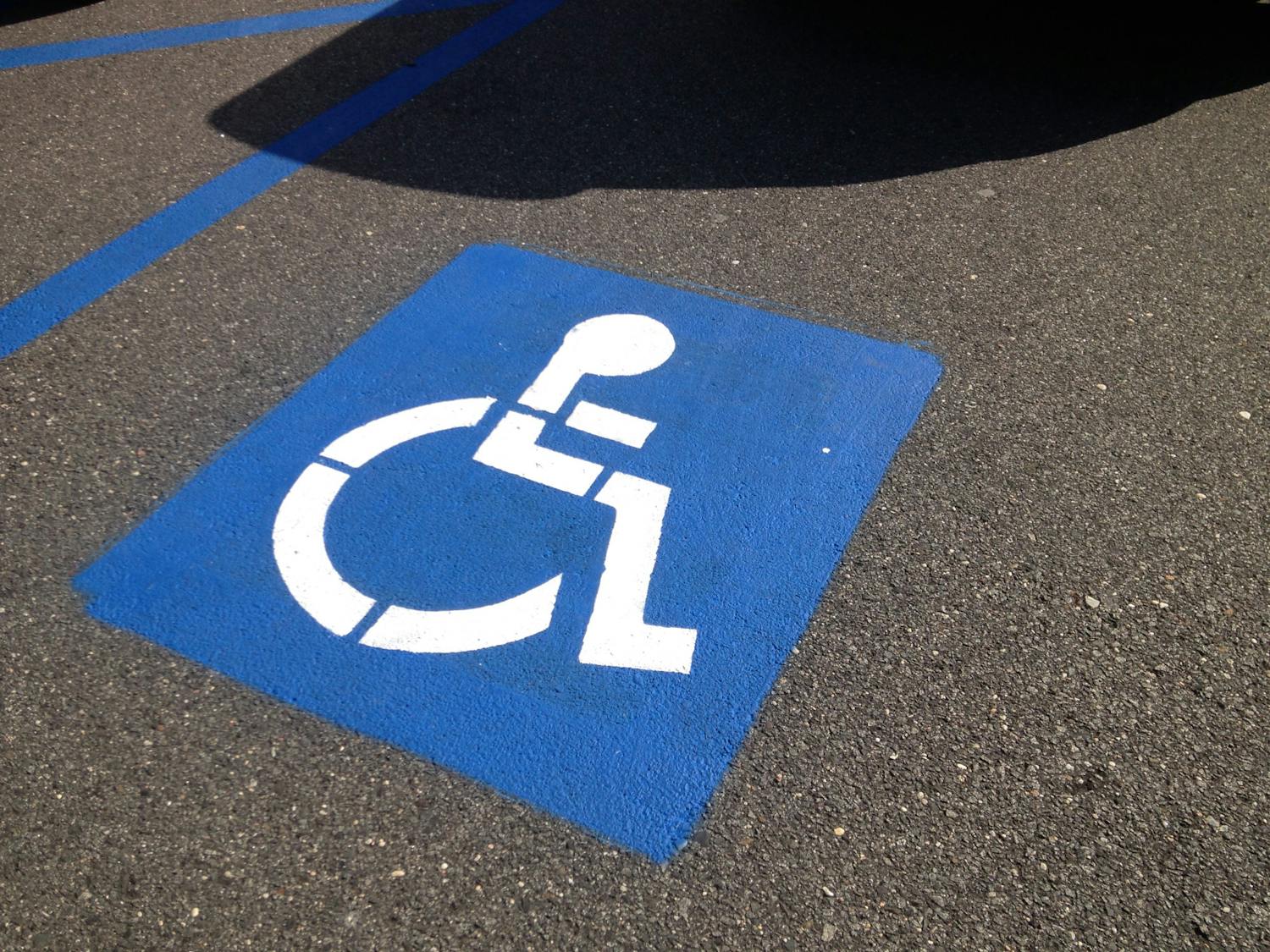 The College’s Accessibility Resource Center (ARC) gives students with disabilities access to a broad range of accommodations for mental and physical disabilities, such as time extensions on assignments and housing accommodations. (Photo courtesy of Flickr/“Accessible Parking” by SmartSign/Aug. 16, 2013)