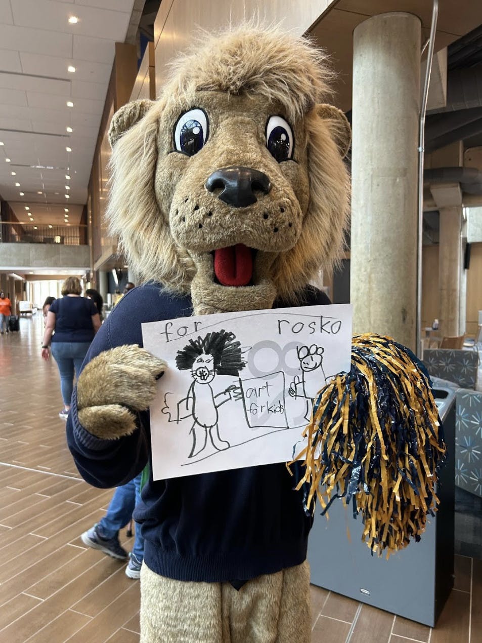 Rosco poses with artwork (Photo courtesy of Trish Le).