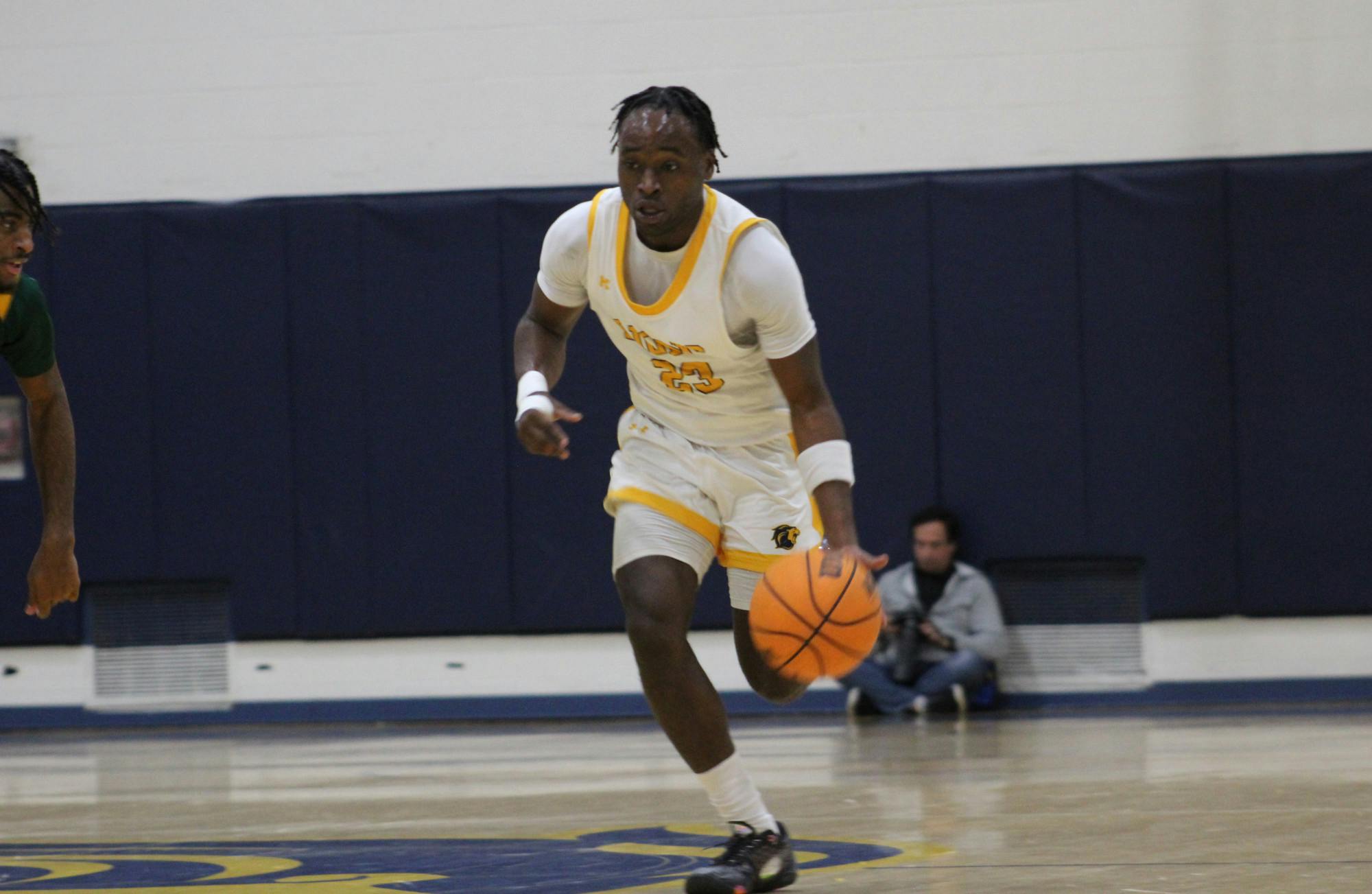 Freshman guard David Alexandre with the ball (Photo courtesy of Elizabeth Gladstone / Multimedia Coordinator).