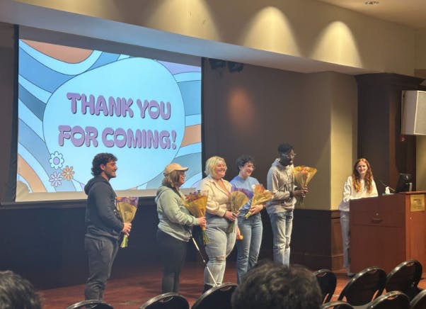 The speakers take a photo together after receiving flowers from the CAPS Peer Educators (From left to right: D’Agati, Juliana, Holman, Leonard and Adu-Gyamfi). (Photo Courtesy of Briana Keenan)