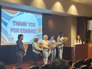 The speakers take a photo together after receiving flowers from the CAPS Peer Educators (From left to right: D’Agati, Juliana, Holman, Leonard and Adu-Gyamfi). (Photo Courtesy of Briana Keenan)