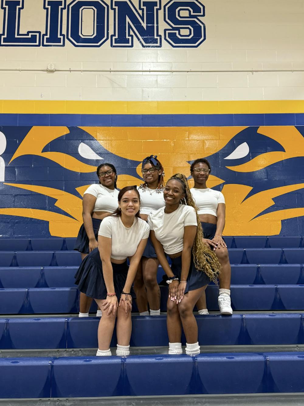 <p><em>Stomp N Shake Lions perform at the College’s men’s basketball games. (Photo courtesy of Adalmaris Castillo) </em></p>