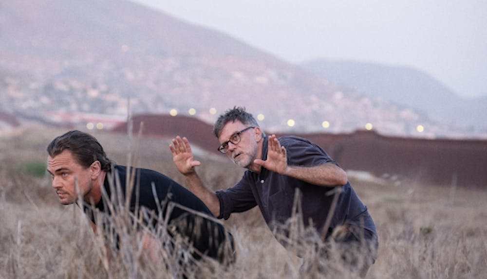 <p><em>Leonardo DiCaprio and Paul Thomas Anderson behind the scenes of “One Battle After Another.” (Photo courtesy of </em><a href="https://www.imdb.com/title/tt30144839/?ref_=ttmi_ov_bk" target=""><em>IMDb</em></a><em>)</em></p>