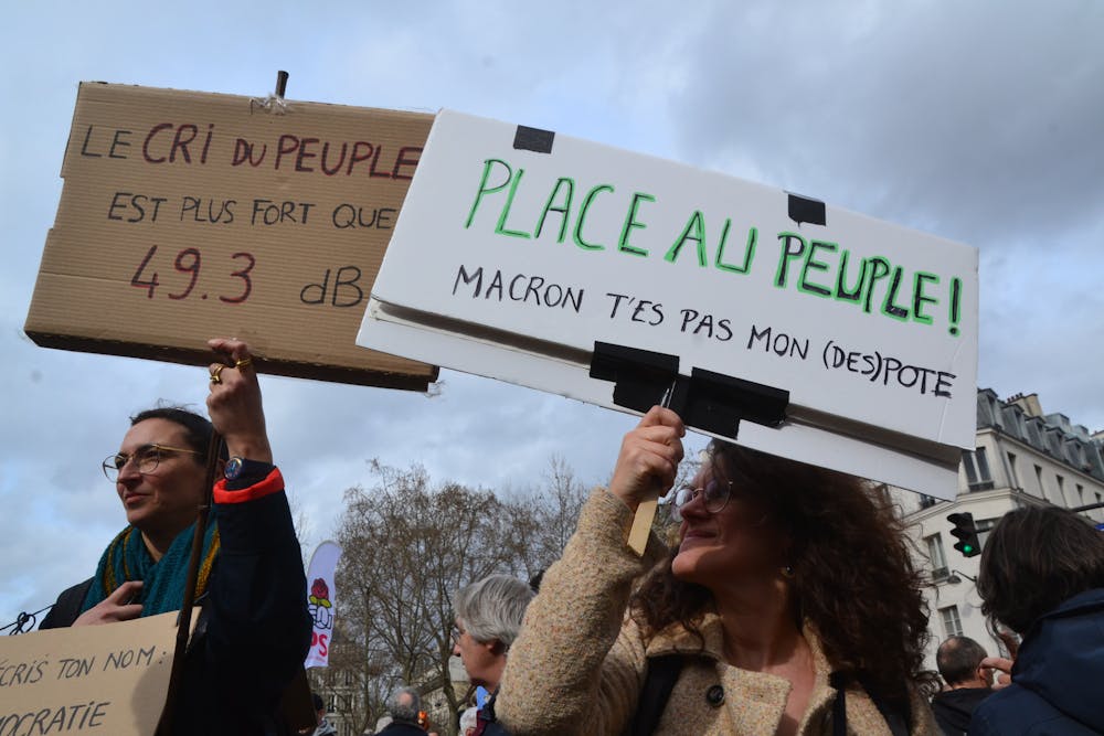 <p><em>Protests have erupted across France over President Emmanuel Macron’s move to force through pension system reforms that will raise the retirement age from 62 to 64 (Photo courtesy of Flickr/“</em><a href="https://www.flickr.com/photos/jmenj/52766726276/in/photolist-2ooPgmG-2ockxBV-2ooPgkK-2ac2zqA-2ivDGqZ-2onmgmP-2ockxKf-2ooPgm1-2onmgmo-2opJbmm-2ofJbot-2ivCw4C-2ivDGrF-2ocnPAZ-2ivDGsC-2ipVZbN-2mhZwzu-2ochVFS-2ohiGNe-2oco2nT-2ocmTmv-2ooLvw7-2ivCvYn-2ivCw5p-2ivDGyz-2ivCvZV-2ivCvoe-2onkQrf-2ivCw2P-2ivzXYm-2ivDGC7-2ooPgnD-2ivCwcZ-2ivCw3q-2ockxLx-2ohk5ai-2ochVMJ-2ooRLHa-2ivzXQ5-2ochVW1-2ivDGJe-2ooLvDB-2ivzY65-2ivzXYS-2oco2pg-2ivzY9X-2ivCwg1-2ivDGKX-2ivzY4w-2hXG85S" target=""><em>Immense manifestation du 23 mars 2023 en défense des retraites</em></a><em>” by Jeanne Menjoulet. March 23, 2023). </em></p>