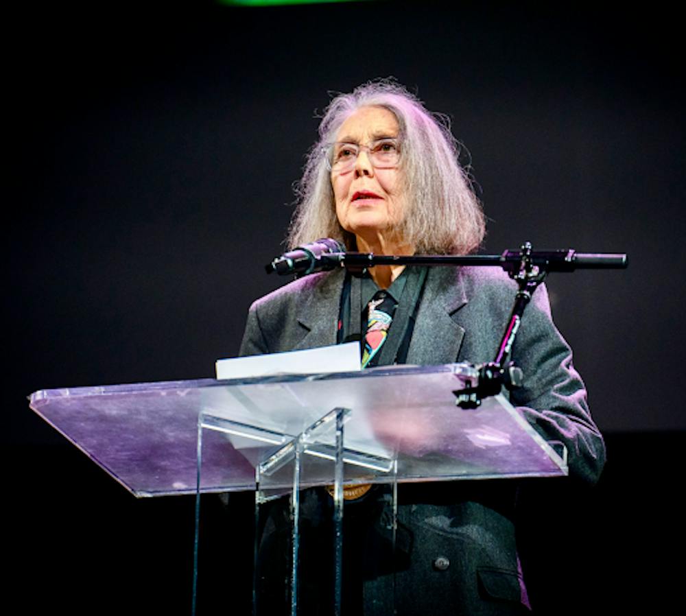 <p><em>Anne Carson reading in the New York University Skirball Center at the 2024 National Book Awards. (Photo courtesy of </em><a href="https://commons.wikimedia.org/wiki/Category:Anne_Carson#/media/File:Anne_Carson,_poet,_at_the_2024_National_Book_Awards_finalist_reading_1.jpg" target=""><em>Wikimedia Commons</em></a><em>)</em></p>